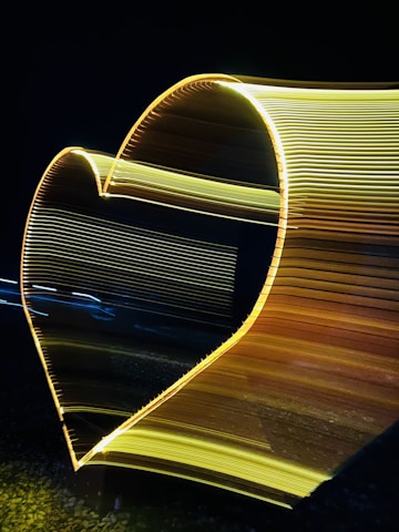 A serene image of a globe intertwined with a glowing heart-shaped aura, symbolizing global care and healing journeys.