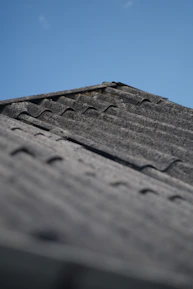 Before and after shots showing a beautifully restored roof with fresh waterproofing.