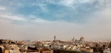 A panoramic shot of a famous European landmark under a clear blue sky