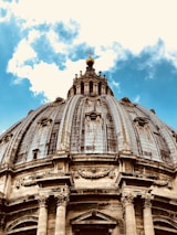 The iconic Holy Sepulcher domes framed by a clear blue sky, inviting visitors to explore.