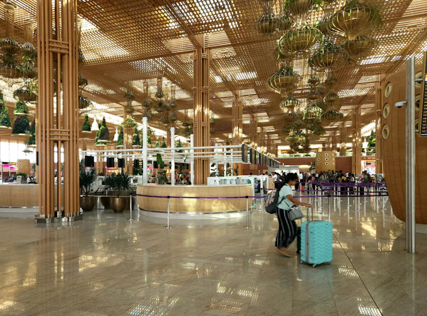 Close-up of the smooth 360° wheels rolling effortlessly on a marble airport floor