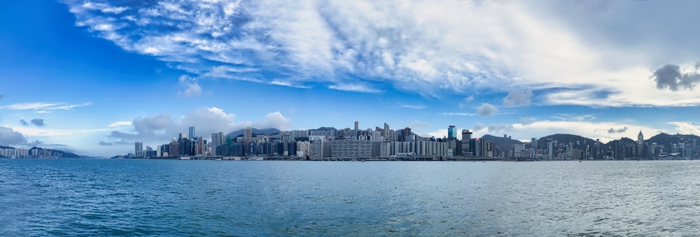 a large body of water with a city in the background