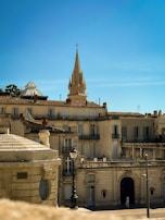 A traveler admiring the ancient architecture of a historic European city.