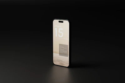Side view of a modern iPhone 13 with a glowing screen on a dark surface
