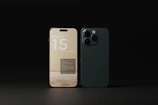 A lineup of iPhone 11 to iPhone 15 models resting on a sleek black surface.