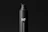 A sleek, black bottle with a pump dispenser top. The bottle has a matte finish and features the text 'MF' in large white letters, with 'pump bottle mockups' written vertically beneath it. The background is also black, creating a minimalist and modern aesthetic.