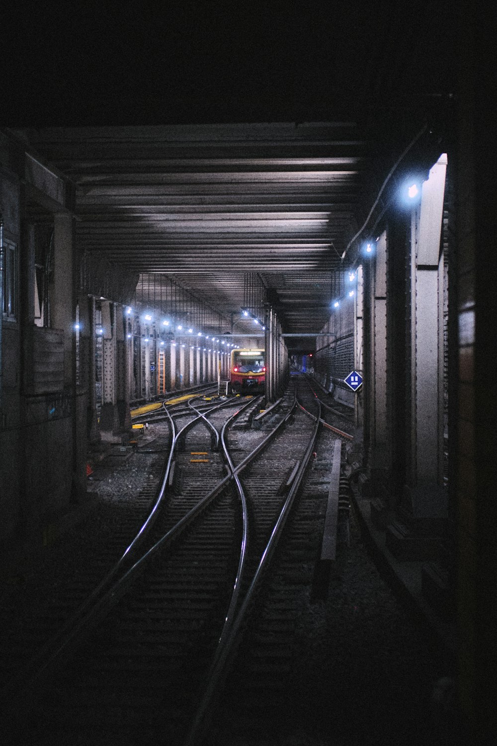 a train station with a train on the tracks