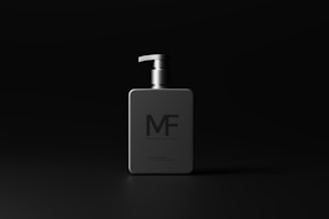 Alphamax M+ bottle with masculine, energetic background