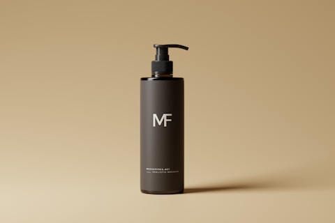 a bottle of mf shampoo on a tan background