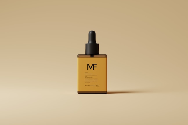 An amber-colored glass dropper bottle with a black cap, labeled with the letters 'MF', is centered against a beige background. The minimalist design emphasizes a sophisticated and elegant appearance.