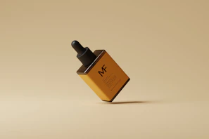 Flat lay of the haloo creator kit including the magnetic bottle and matching sleeve in beige on a minimalist white surface.
