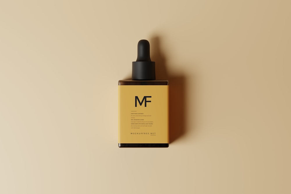 a bottle of mf on a tan background