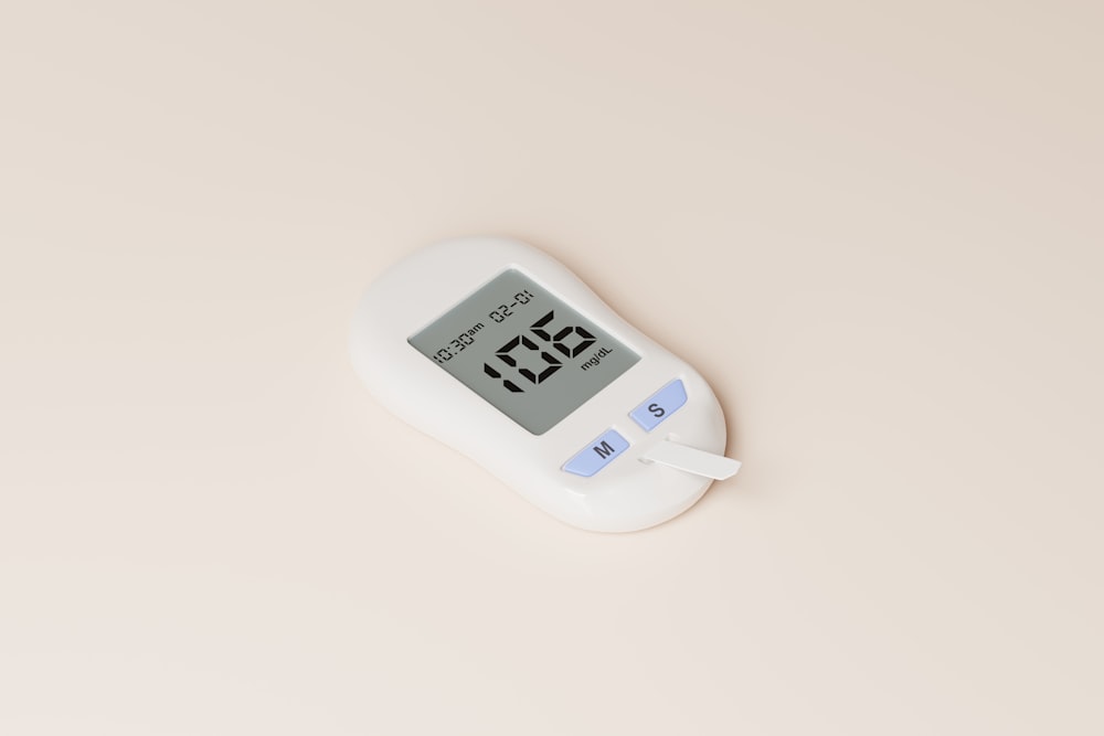 a digital thermometer on a white surface