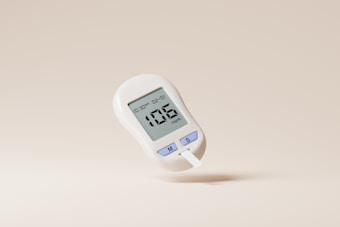 A digital glucose meter displaying a reading of 106 mg/dL. The device is predominantly white with purple buttons labeled with 'M' and 'S'. A test strip is inserted into the bottom of the meter. The background is a plain, light beige color.
