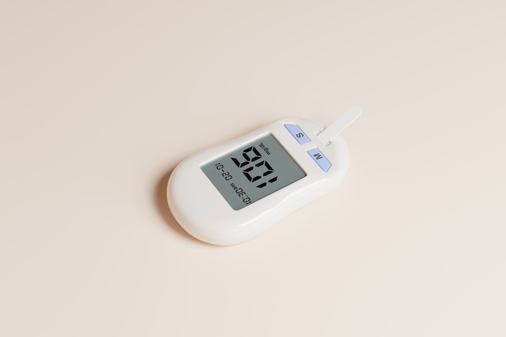 a digital thermometer on a white surface
