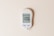 A digital glucose meter displaying a blood sugar reading of 106 mg/dL, with a date and time shown as 10:30 am on 02-01. The device features two buttons labeled 'M' and 'S' and is designed in a sleek, modern style on a plain, light background.