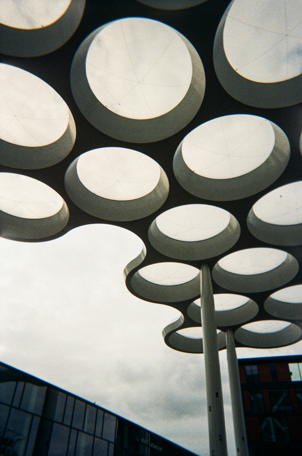 a group of circular objects in front of a building