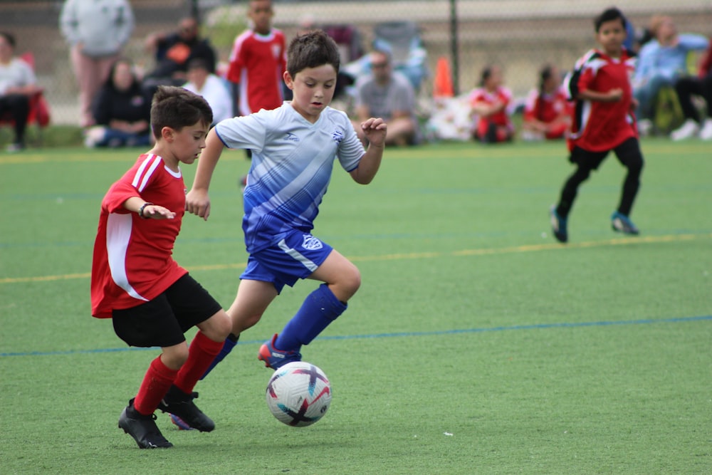 a group of young boys playing a game of soccer