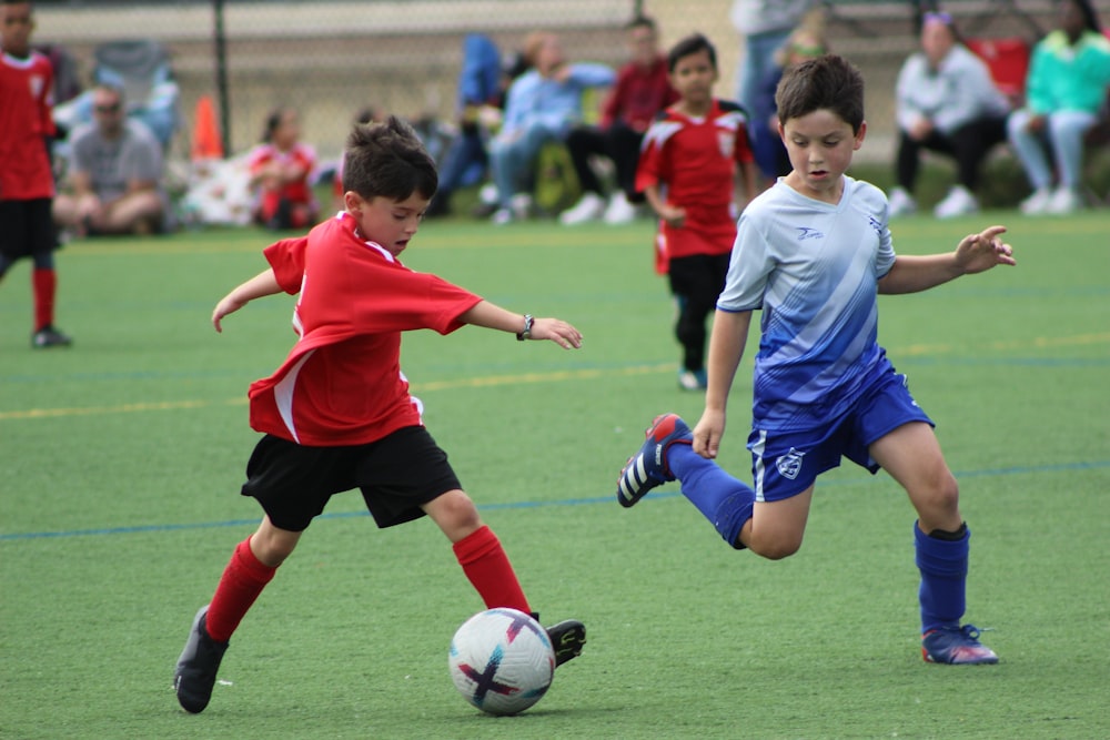 a group of young boys playing a game of soccer