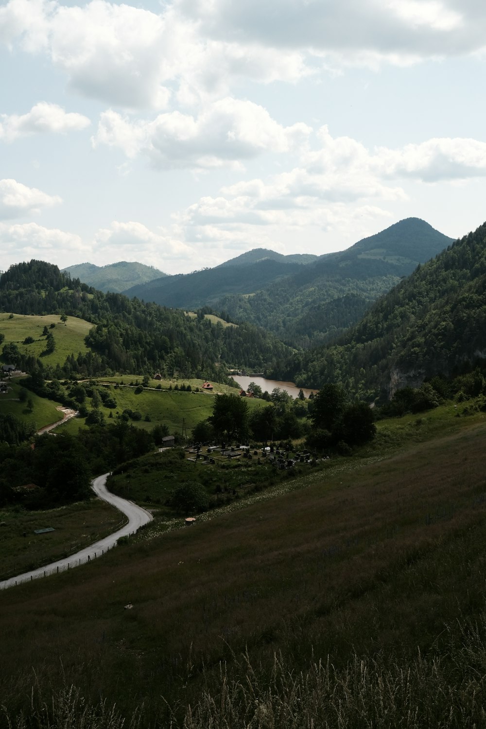 a scenic view of a valley with a river running through it