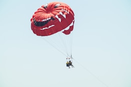Parachute Painting team members smiling and posing in front of a freshly painted business storefront.