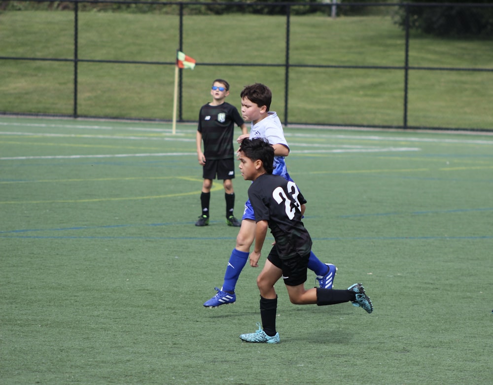 a group of young men playing a game of soccer