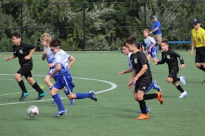 a group of young boys playing a game of soccer