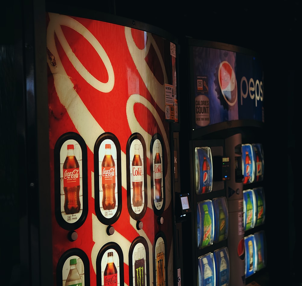 a vending machine with a soda advertisement on it