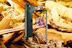 A close-up of a smartphone screen showing the Teen Patti Gold game interface with gold and black themed graphics.