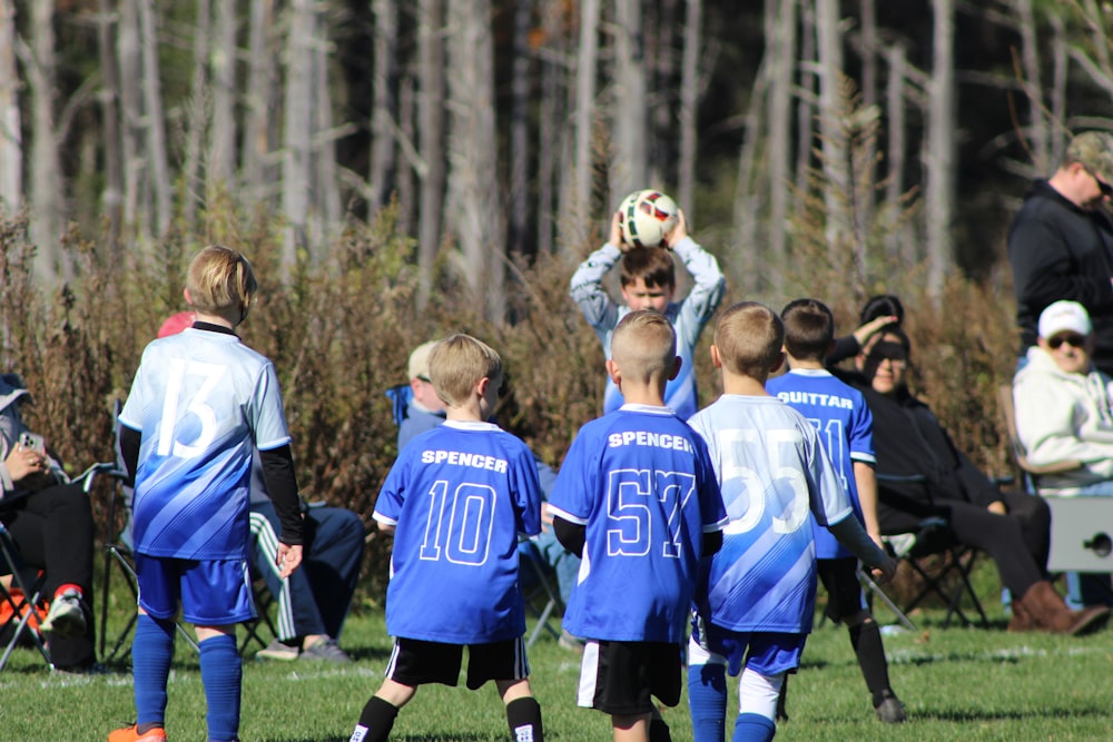 a group of young boys playing a game of soccer