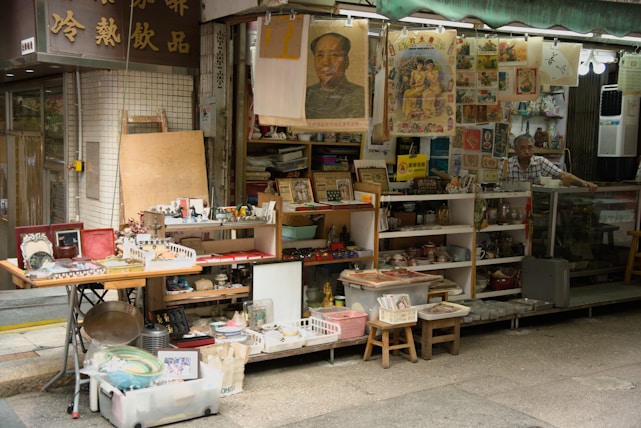 Vintage antiques and collectibles displayed at a flea market stall