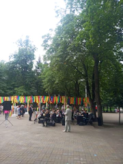 A vibrant community band performing outdoors in a small town square