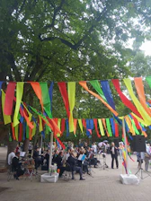 A lively orchestra performing outdoors in Três Coroas with smiling musicians.
