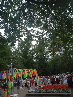 A vibrant community gathering in a sunny park sharing healthy food and laughter.