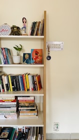 A fenoffs bookcase showcasing adjustable shelves filled with books and decorative office items.