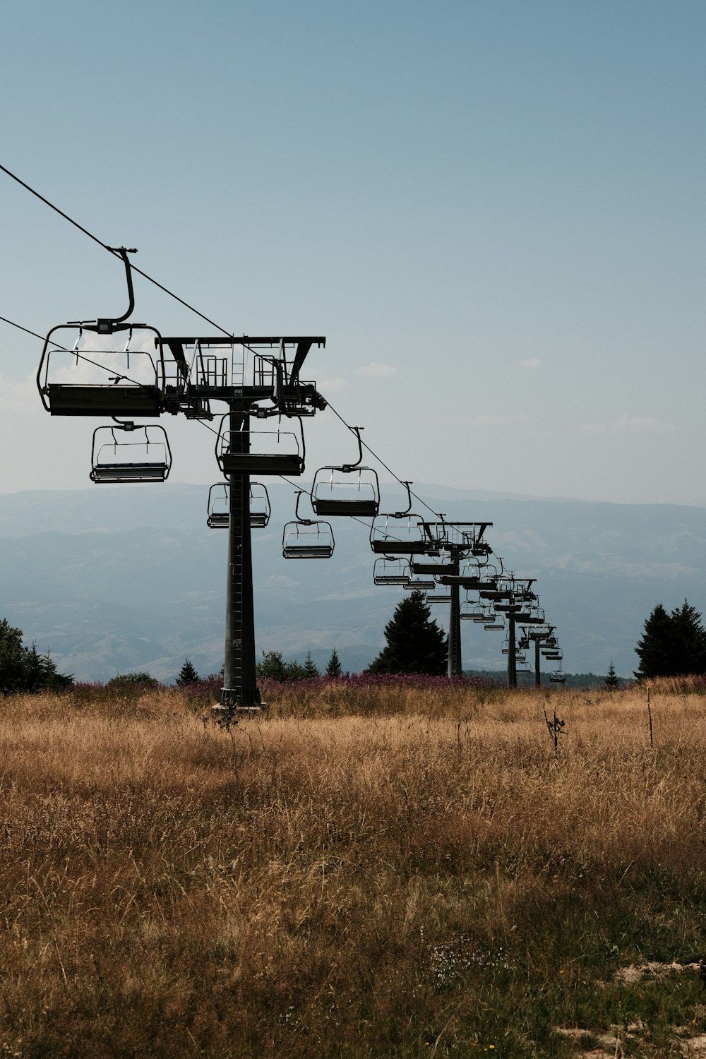 a ski lift going up the side of a hill