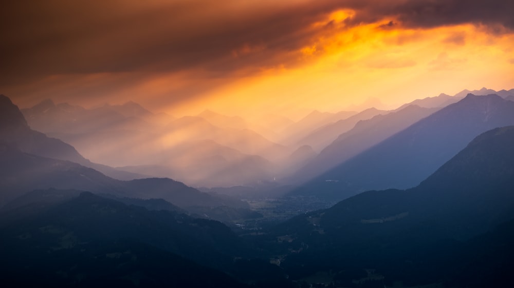 a view of a mountain range at sunset