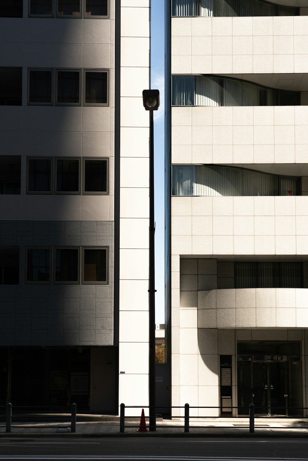 a tall building sitting next to a street light