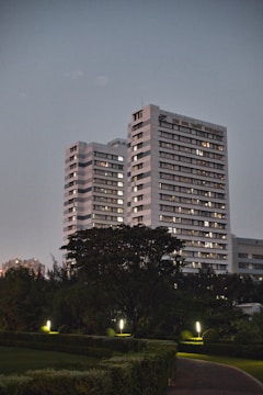 a couple of tall buildings sitting next to each other