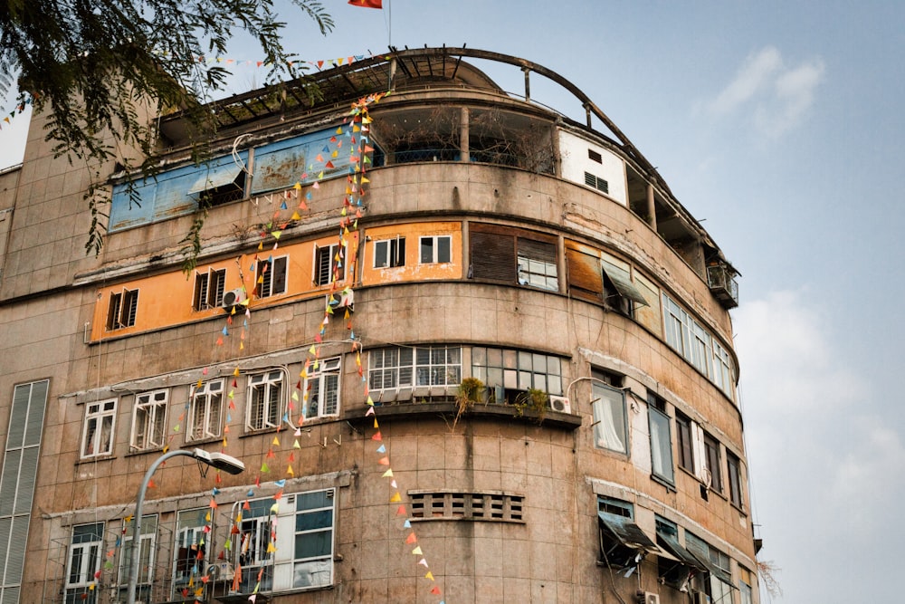 a tall building with lots of windows and balconies