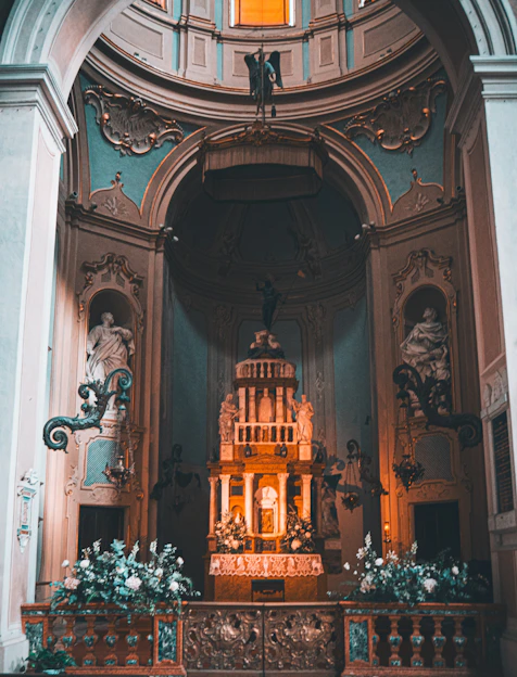 A beautifully decorated altar inside the Sagrado Corazón de Jesús church with soft natural light.