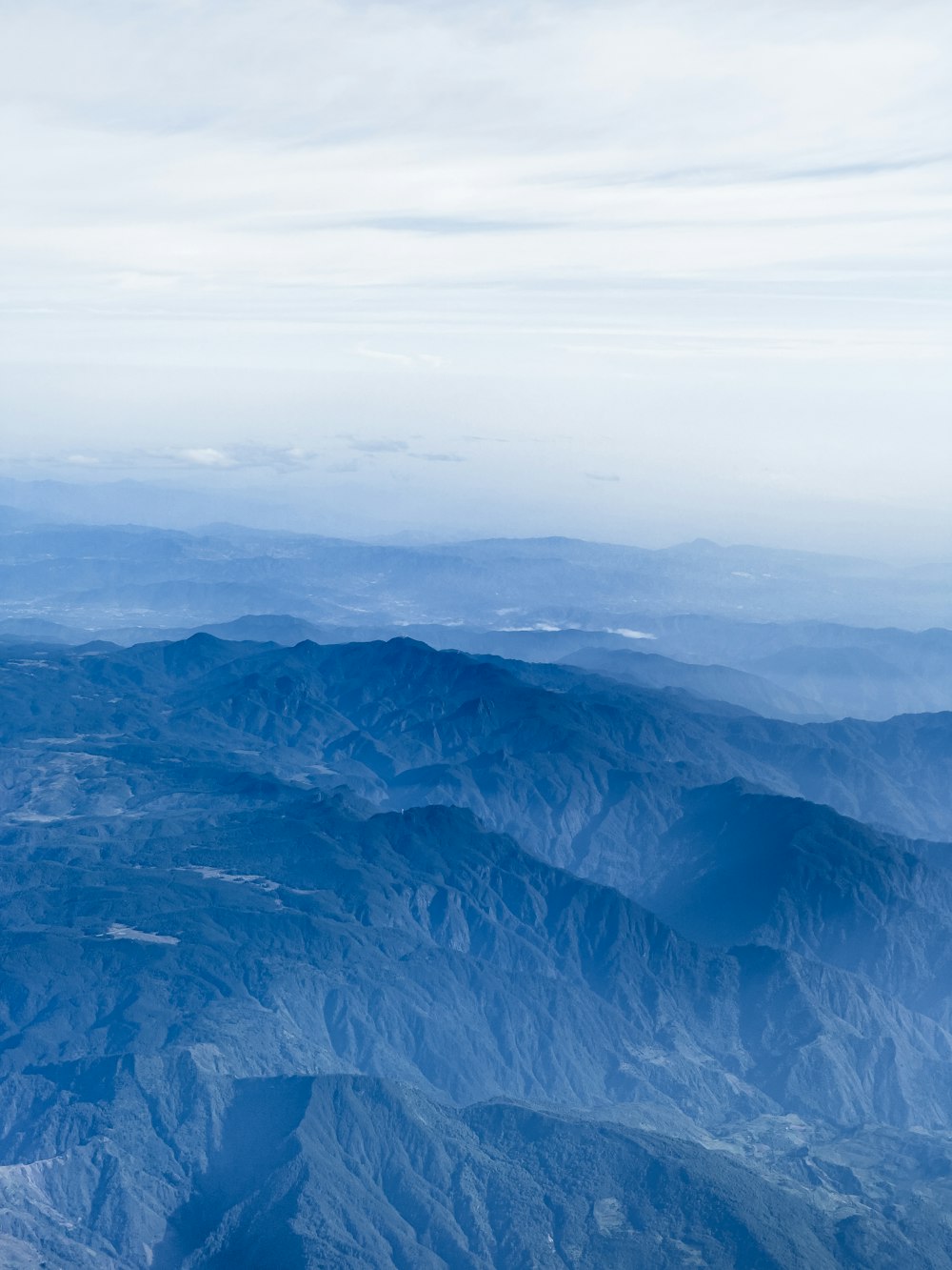 a view of a mountain range from an airplane