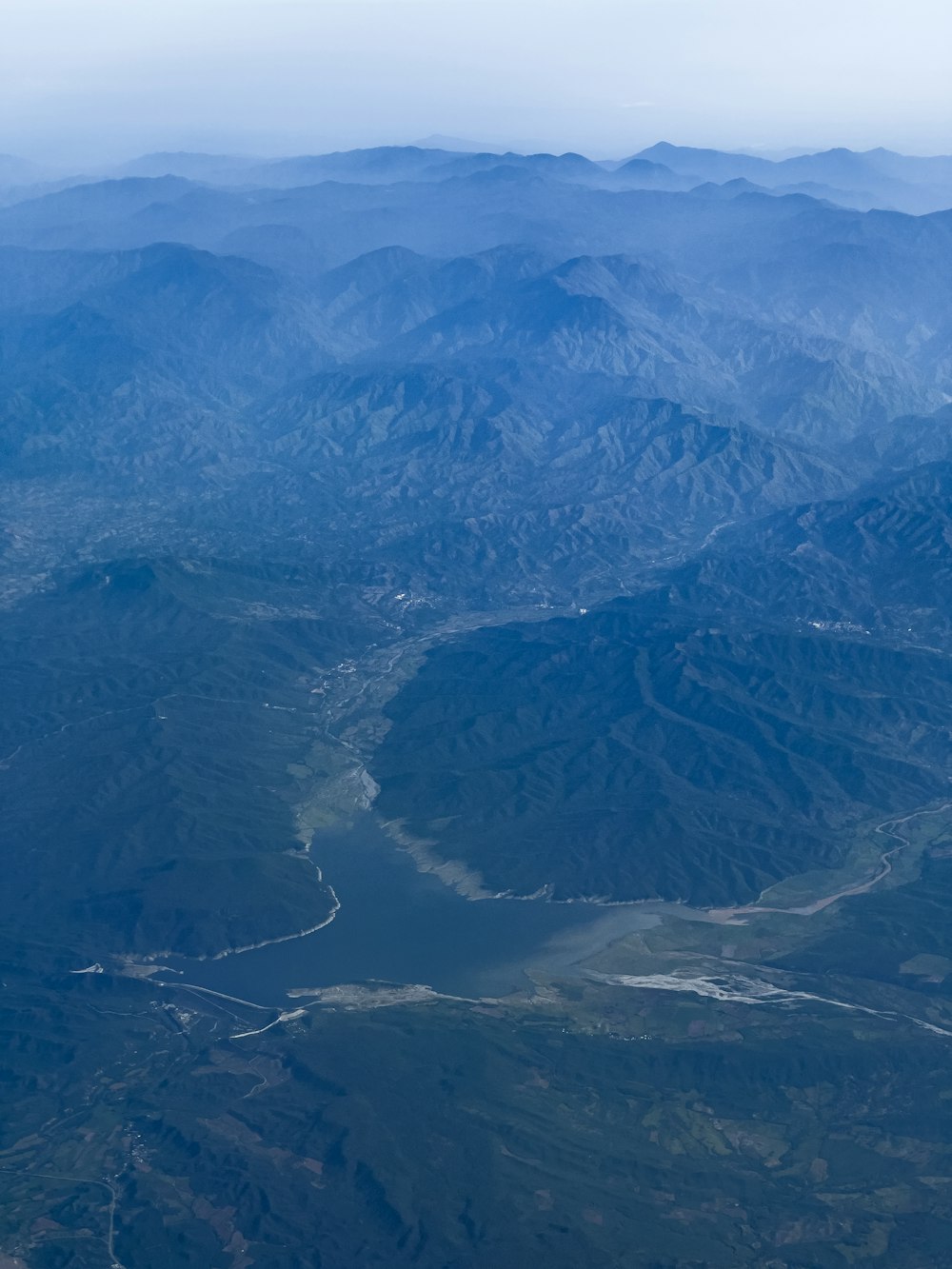 a view of the mountains from an airplane