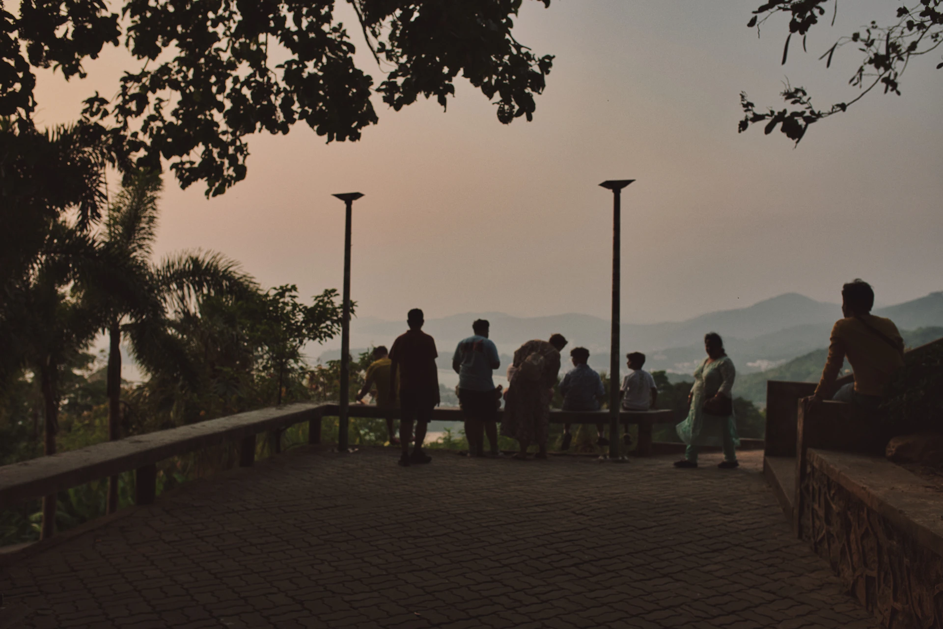 Guests enjoying a peaceful morning on the terrace overlooking the rolling hills of Gipuzkoa at sunrise.