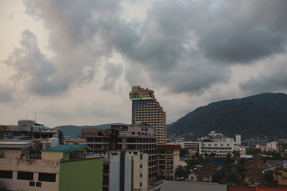 a cloudy sky over a city with buildings