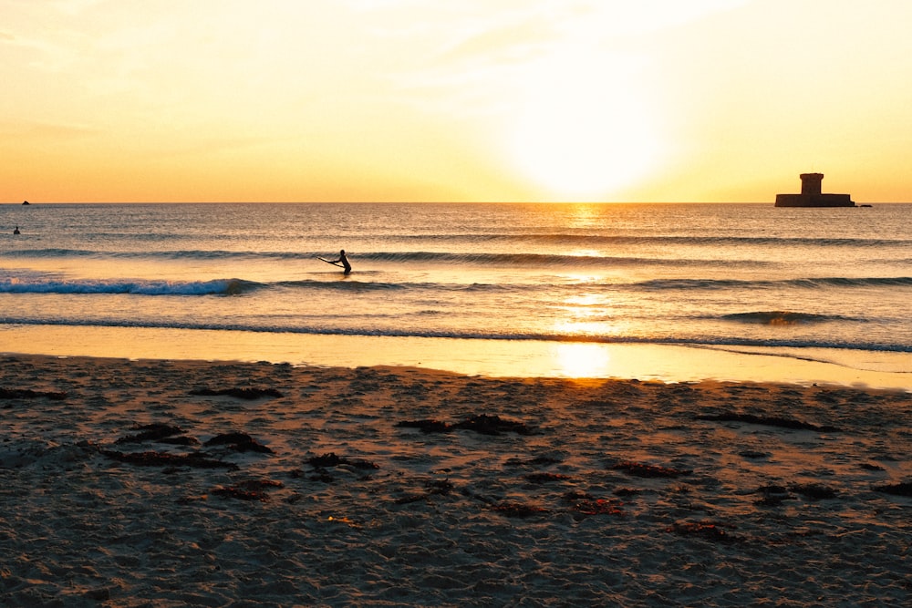 a person riding a surfboard on a wave in the ocean