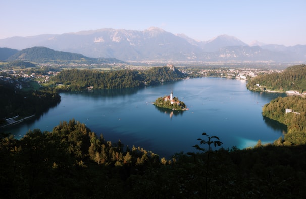 A serene lake surrounded by lush greenery in the Balkans.