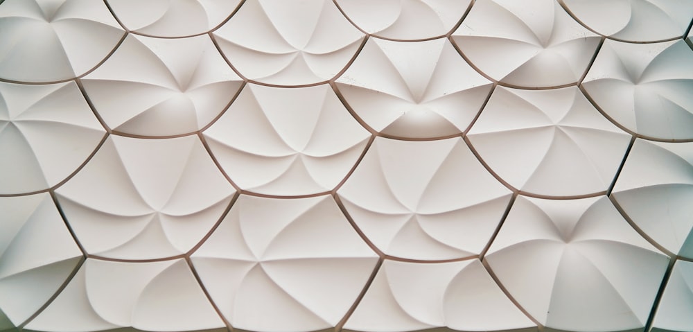 a close up of a wall made of white paper