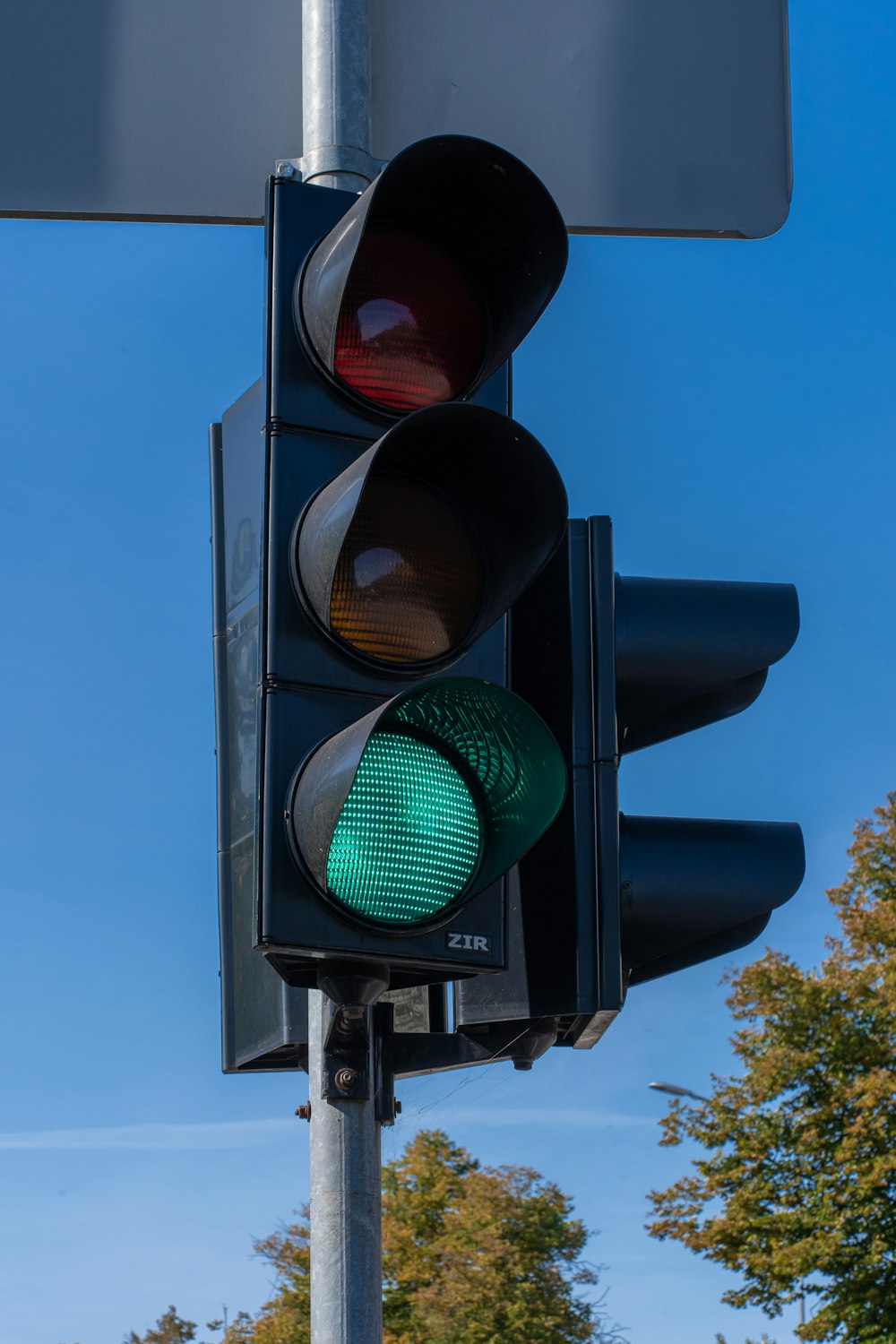 a traffic light with a green light on it