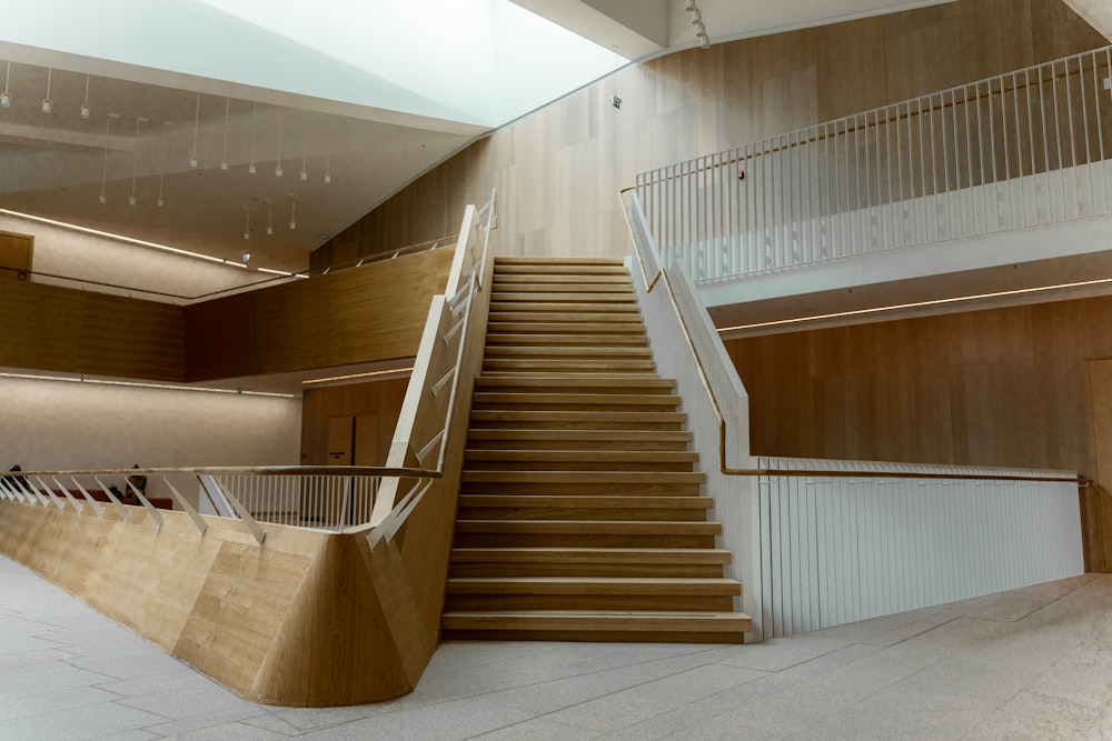 a staircase in a large building with a skylight